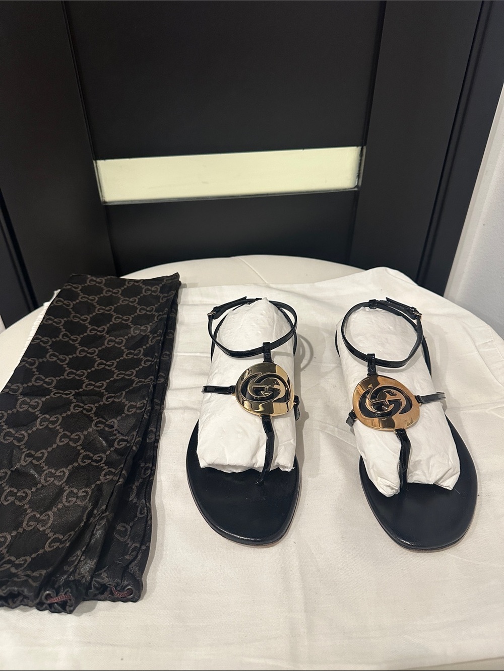 Gucci Black Leather T-Strap Sandals with Gold Logo Medallions